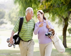 Couple Enjoying A Game Of Golf